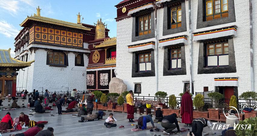 Devoted Tibetan pilgrims prostrating before the Jokhang Temple